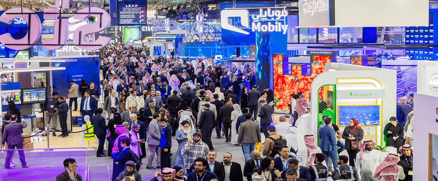 A crowded international tech conference hall