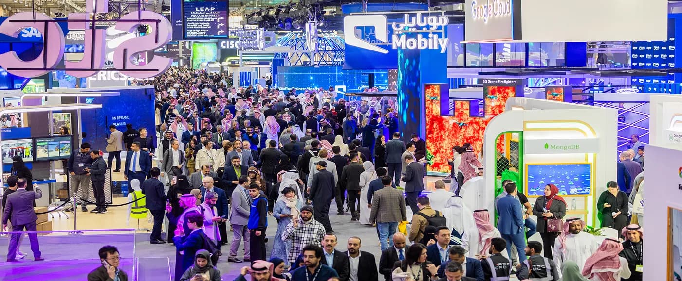 A crowded international tech conference hall